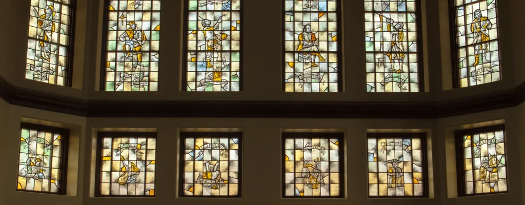 Stained glass windows in the Fiondella Great Room in Ruane Hall